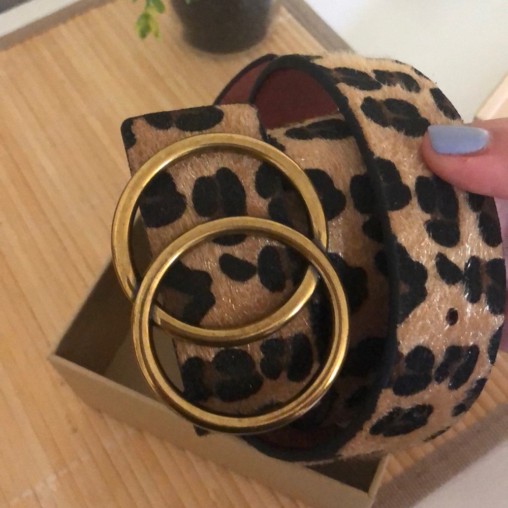 Never worn animal print belt. In original box